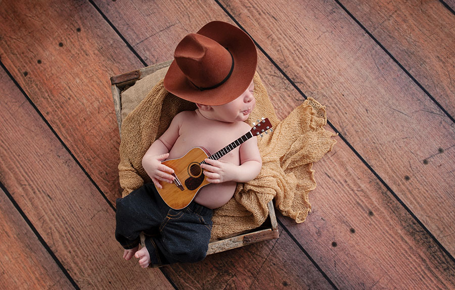 baby-cowboy-sleeping-with-a-guitar