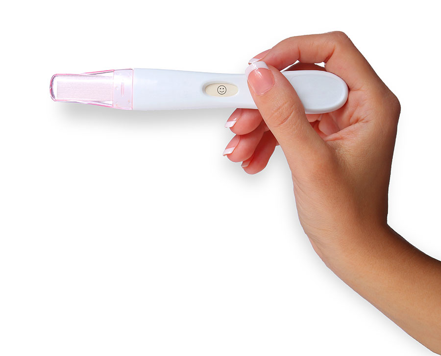 Female-hand-holding-pregnancy-test