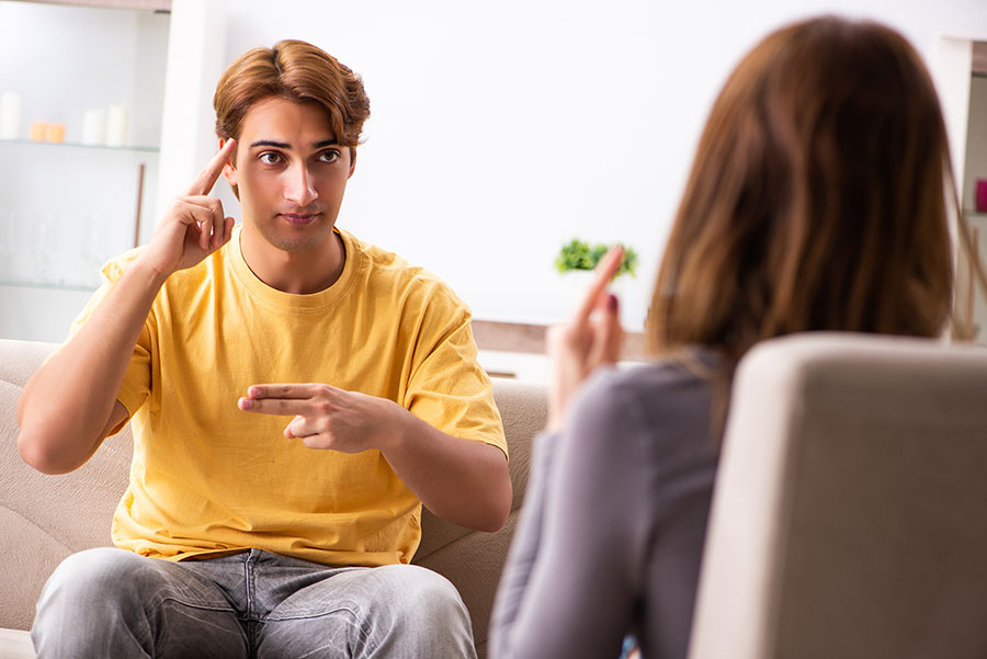 Young-man-talking-in-sign-language