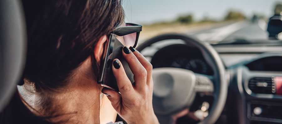 woman-talking-on-phone-while-driving